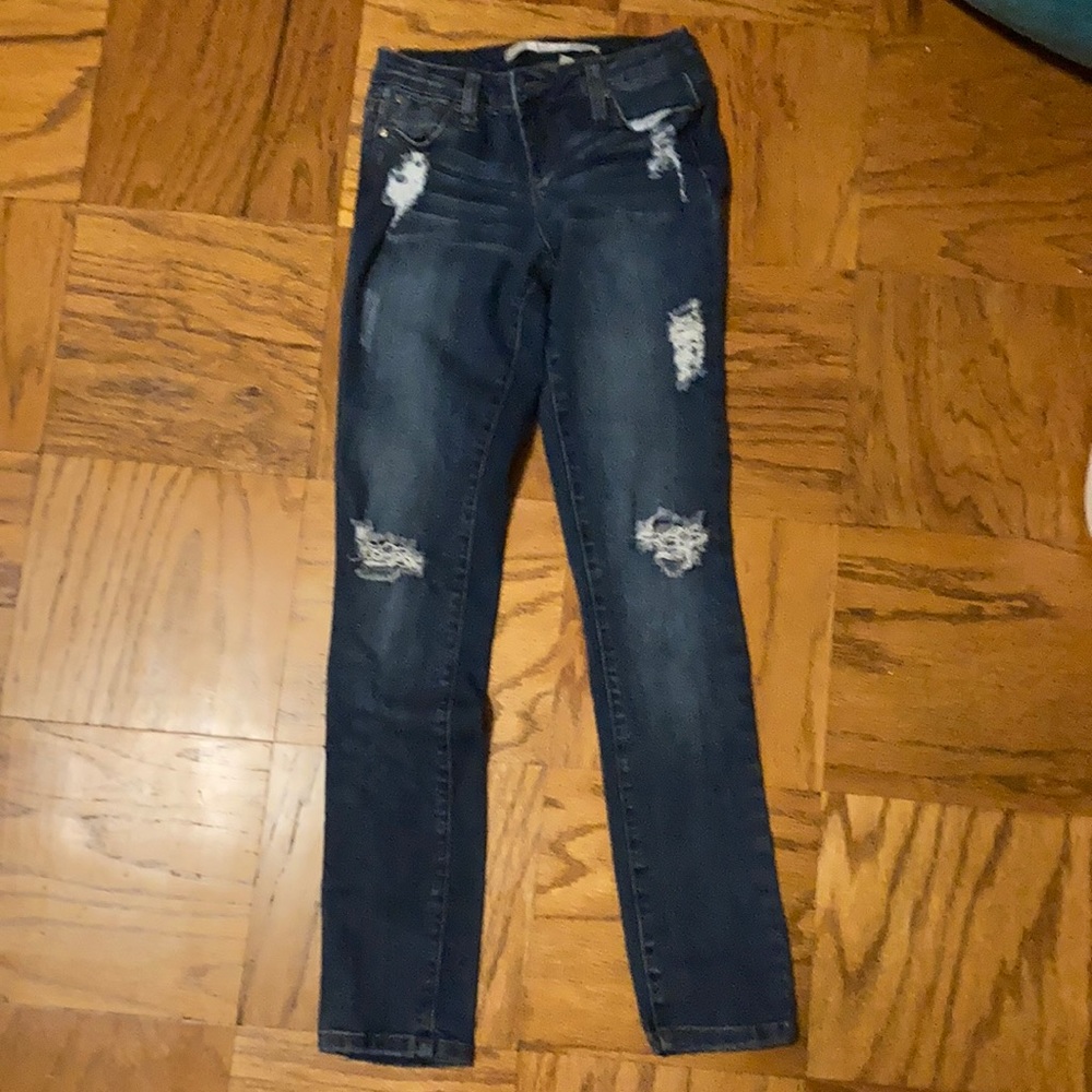 Kids dark blue washed ripped jeans.